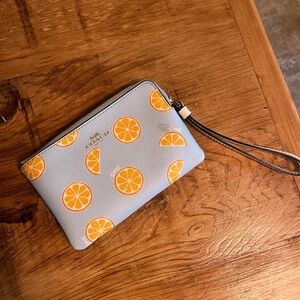 Coach Light Blue Wristlet with Citrus Orange Design